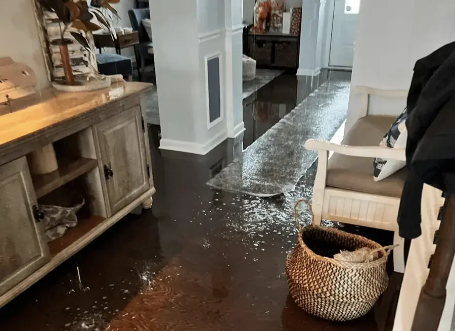 Water spread across a finished lower level in a Huntersville home